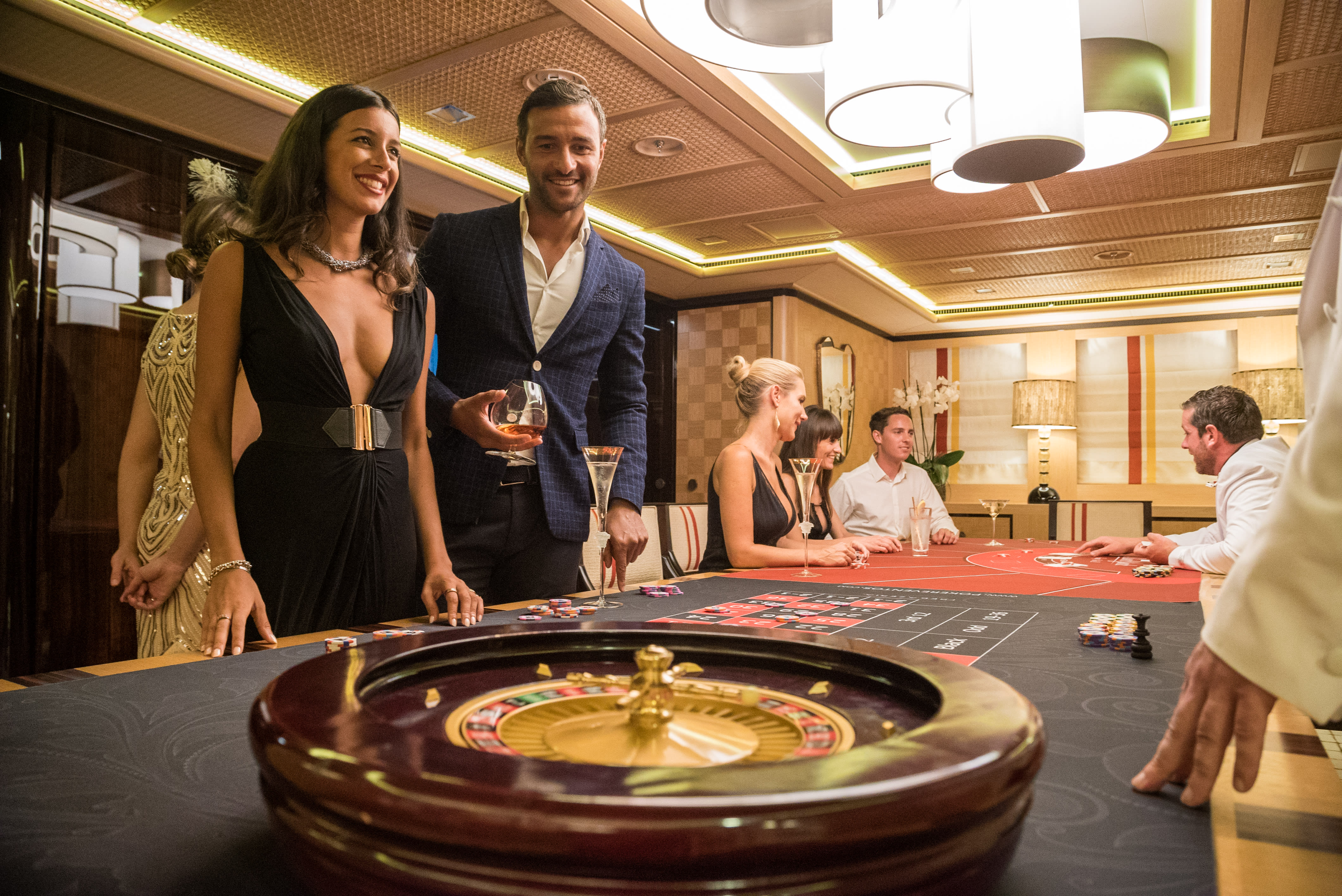 Couple in a casino on a superyacht